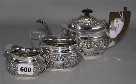 A Victorian embossed silver three-piece tea service, Birmingham 1900